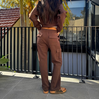 Back view of INTIMISSY Studio Plush cargo pants in Espresso featuring soft plush texture and relaxed silhouette